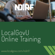 Person wearing a button up sits at a computer and appears to take an online class. A green rectangle is below the picture and includes the headline LocalGovU Online Training and in smaller text below the headline www.localgovu.com/ndirf.